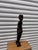 Hand-carved folk art sculptureFeatures a standing male figure with a drumCommon mid-to-late 20th-century decorative...
