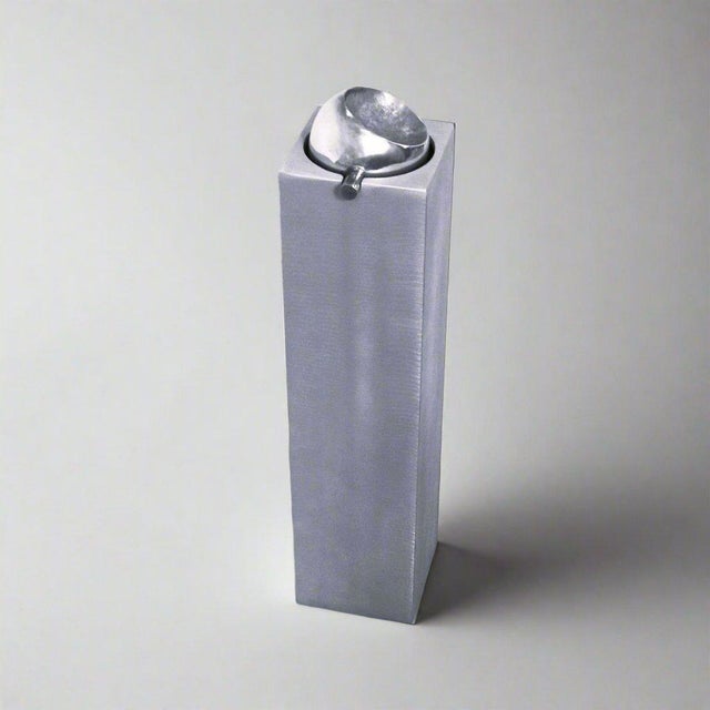 A sculptural Modernist ashtray by artist Lorenzo Burchiellaro. Textured cast aluminum Signed Burchiellaro.