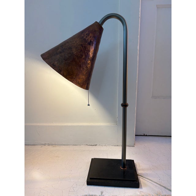 Art Deco revival hand crafted table lamp. Conical, hammered copper shade with hand wrought steel base and ball pull chain...