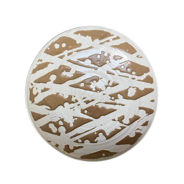 A studio pottery ceramic bowl by Roy Hamilton specially designed for Steve Chase in the 1980's. The light brown ceramic...