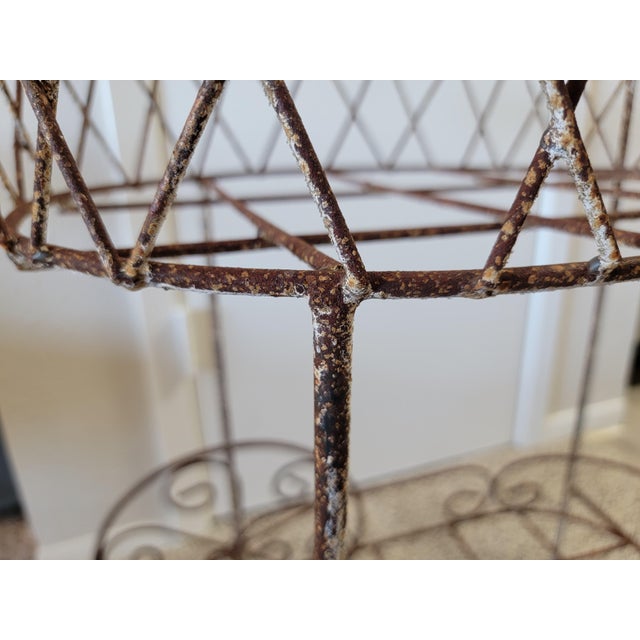 Rustic cart for plants. The wheels are not movable, it's in a fixed position, and very sturdy. It looks like it was...