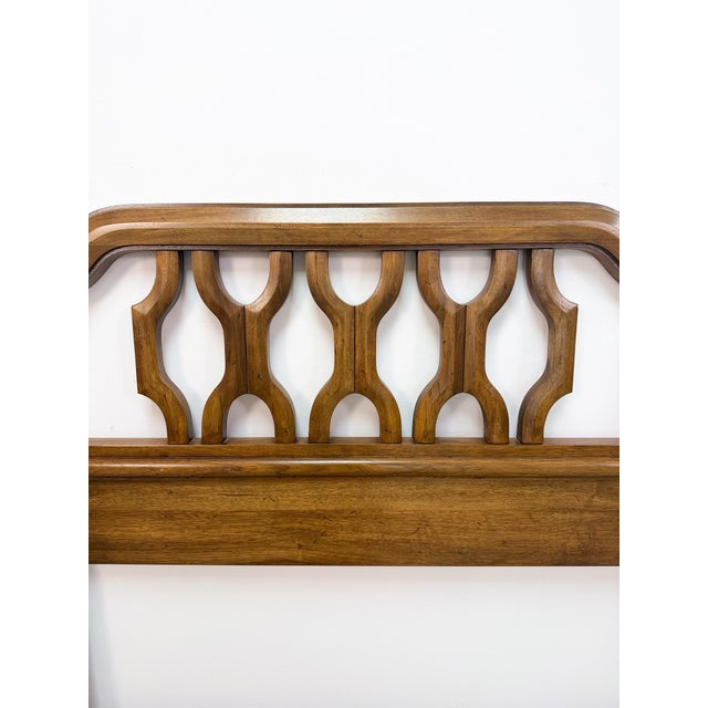Complete your bedroom with this vintage mid-century modern Thomasville king headboard, featuring a beautifully sculpted...