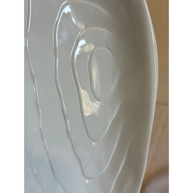 An elegant vintage finds piece from Este Ceramiche, Italy — this dish is shaped like an oyster shell with subtly ridged,...