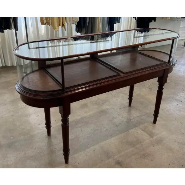 Gently used display case in an understated antique style with gorgeous bow end cabinet. The cabinet is constructed of...