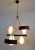 Beautiful Italian modernist chandelier made of teak and 4 white glass shades with brass and metal lamp frame and many...