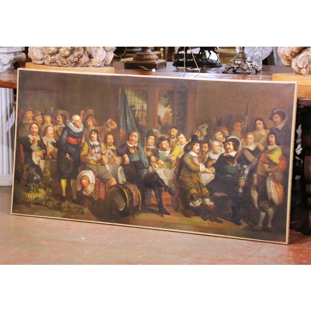 Large European historical painting depicting a lively banquet of officers and gentlemen gathered around a richly set...