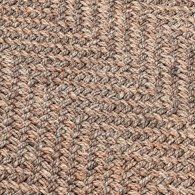 Hand woven jute and wool rug in natural tones. Stylish chevron pattern. Available in numerous sizes. Please note that its...