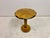 An Art Deco quarter-veneered circular lamp table, likely dating from the 1930s, raised on a turned central column with...