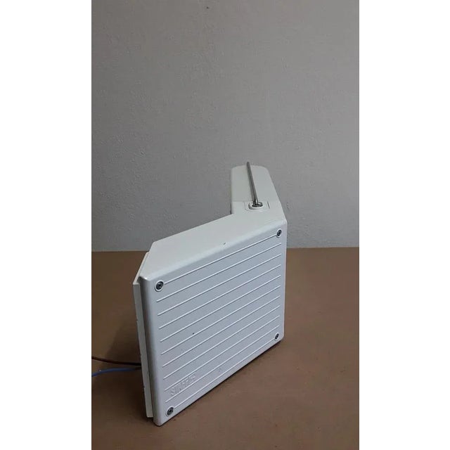 Vintage German Wall Lamp in White Painted Metal from Staff, 1970s, in Very Good conditions. Designed 1970 to 1979 This...