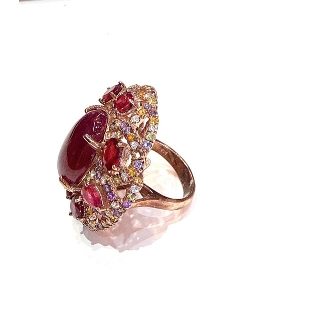 Bochic “Capri” 19 Carat Ruby, Multi Sapphire & Amethyst Cocktail Ring in 18K Gold & Silver A bold and captivating...