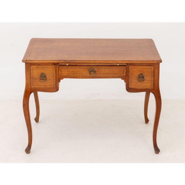 Louis XV Style Fruitwood Desk, with three drawers above four cabriole legs. 29.75" H x 39" W x 23.5" D. Provenance: From a...