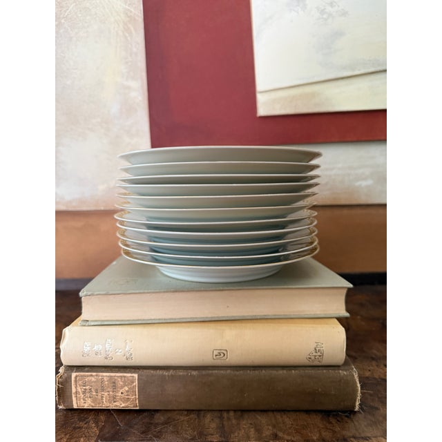 Elegant and timeless, this set of eleven H&C Selb Bavaria porcelain plates features a crisp white porcelain body framed by...