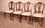 Exquisite set of four late 19th-century mahogany chairs with inlays. A truly beautiful set distinguished by its...
