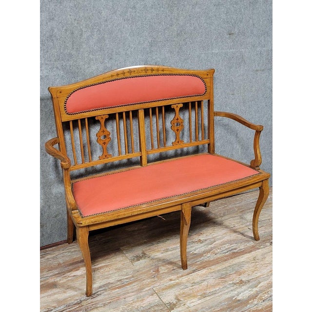 Art Nouveau period bench in light wood and marquetry, circa 1900 Plain fabric Openwork backrest Shaped armrests Curved...