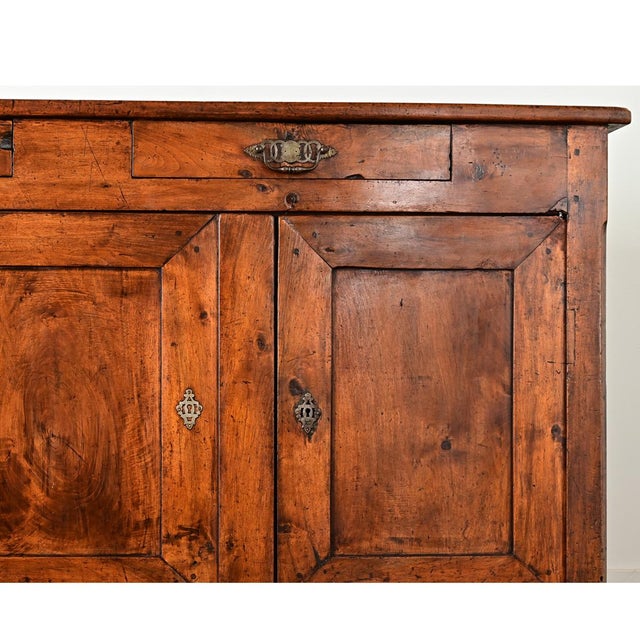 A gorgeous enfilade from 19th century France, Louis Philippe period, in solid walnut. The top surface is simply...