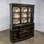 Gorgeous vintage Chinoiserie breakfront China hutch cabinet or drop front secretary bookcase composed of 2 pieces, each...