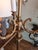 Vintage, brass arms holds 3 lights with a onyx and brass carved base floor lamp from 20th‑century.