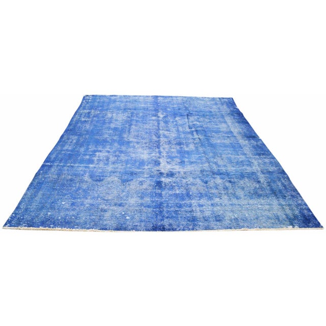 Hand-knotted with care using traditional rug-making techniques, this vintage wool rug blends timeless craftsmanship with a...