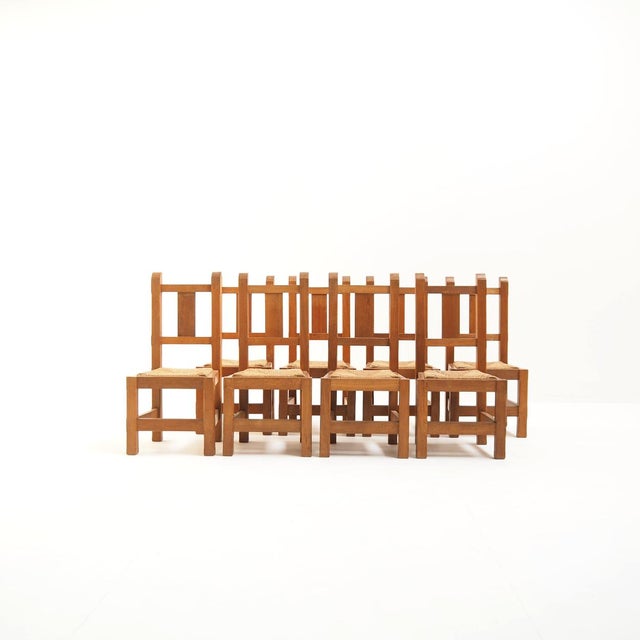 This set of eight handmade solid oak chairs embodies the honest craftsmanship of the 1970s. Designed and built by their...