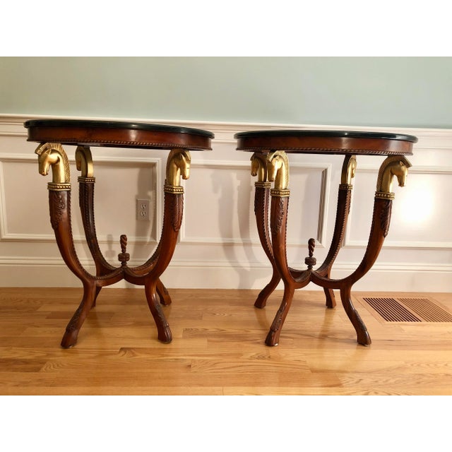 Stunning and stately pair of unique French Maison Charles-style beautifully detailed marble top side or end tables with...