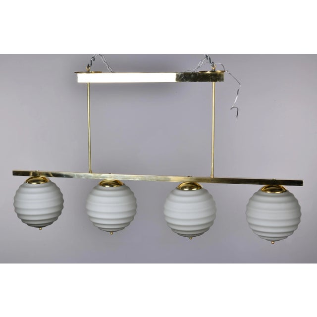 New Italian Fixture With 4 Pale Taupe Globes on Horizontal Brass Bar For Sale In Detroit - Image 6 of 12