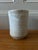 Small wide mouth Ceramic vase with irregular beige pattern. Its delicate color and plane shape makes it extremely...