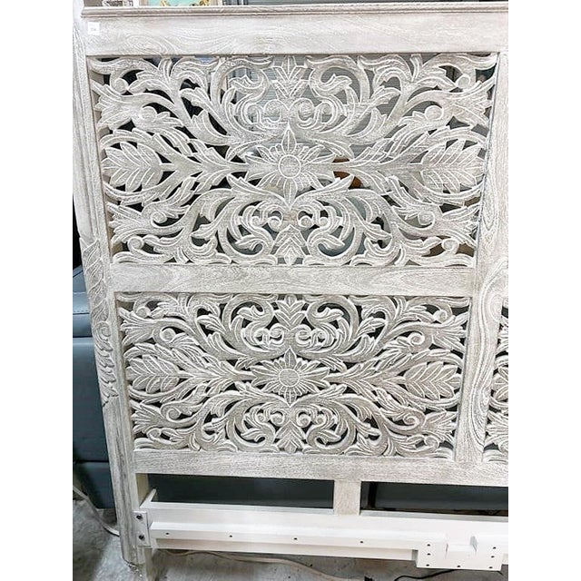 Unique hand carved mangowood king sized headboard by Mazlum,. This was a floor model, never slept in. Solid and sturdy,...