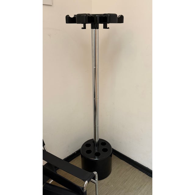 Beautiful mid-century coat rack by Velca, designed by Paolo Orlandini and Roberto Lucchi. Chrome-plated steel and black...