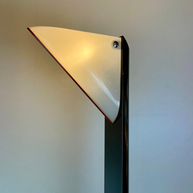 Tall floor lamp composed of a black metal painted base, a half-cylinder grey leg and a white Murano glass lampshade with a...