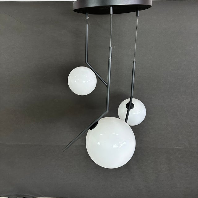 Dimensions: H 35.5” x W 21” Vintage Monroe three-light pendant lamp with black metallic rods. Please see our other...