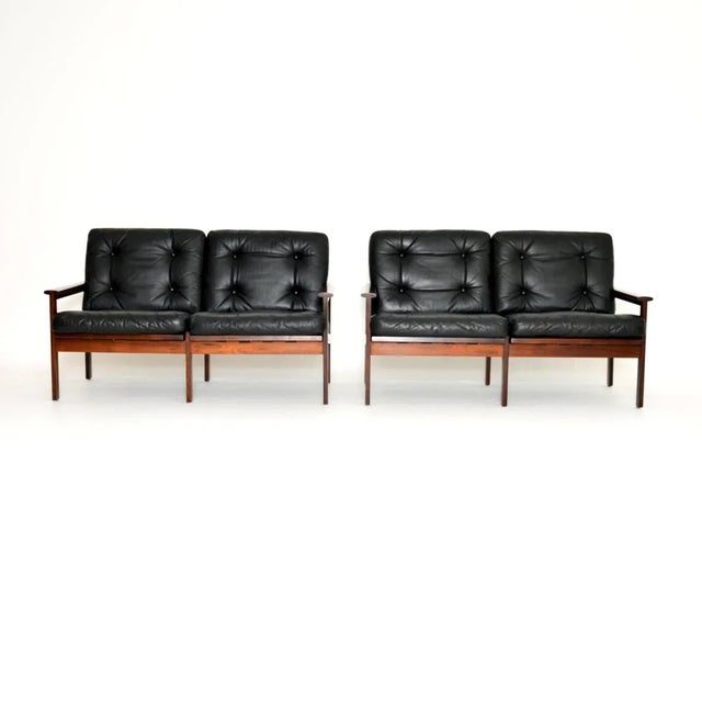A stunning pair of Danish leather Capella sofas by Illum Wikkelso. They were made in Denmark in the 1960’s. The quality is...