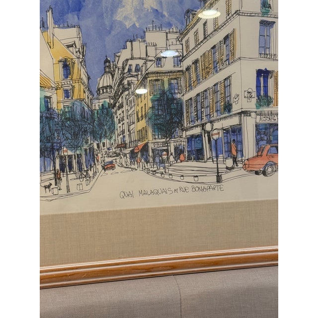 Beautiful Paris cityscape drawing titled “Quai Malaquais & Rue Bonaparte.” Features classic Haussmann architecture,...