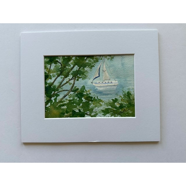 When I walked to the end of Tarpon Street, on Anna Maria Island, I saw this beautiful sailboat beyond the foliage. Signed...