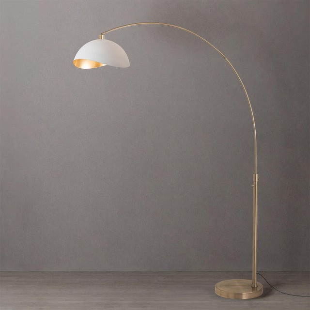 1960 design, reborn in weathered brass and white gold - light that floats above your favorite room. The Luna Bella Arc...