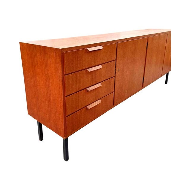 This rare teak sideboard embodies the aesthetic ideals of Scandinavian modernism from the 1960s. Its clean lines,...