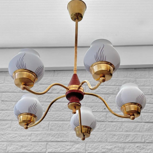 A beautiful Scandinavian mid-century chandelier, produced by an unidentified Swedish manufacturer in the 1940s. Crafted...
