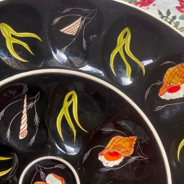 Oyster serving dish, with 24 oyster / shell compartments and one in the center for lemon slices. This spectacular black...