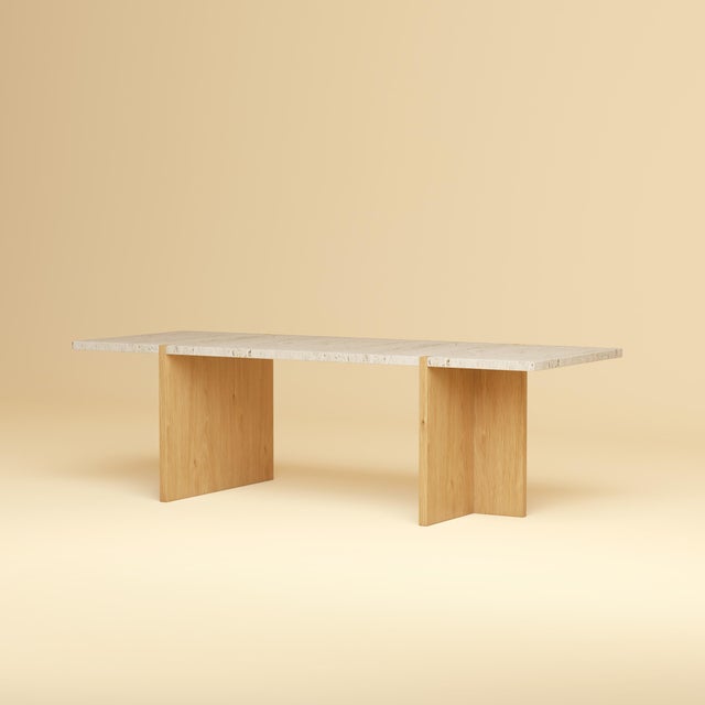 Roman travertine over a base of solid oak gives the Palm its balance. It is a low, elongated table for the space in front...