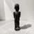 This striking mid-20th-century hand-carved wooden sculpture showcases traditional African tribal craftsmanship and elegant...