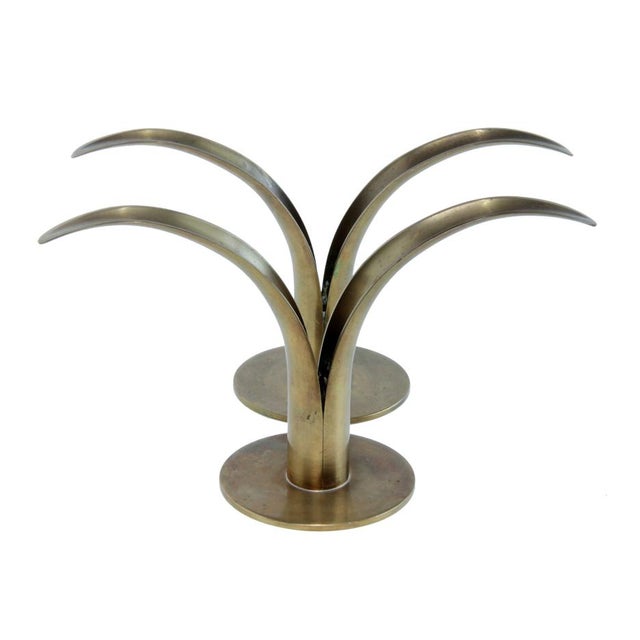 Add a Scandinavian flair to your tabletops with this beautiful pair of iconic brass candlesticks designed by Ivar Alenius...