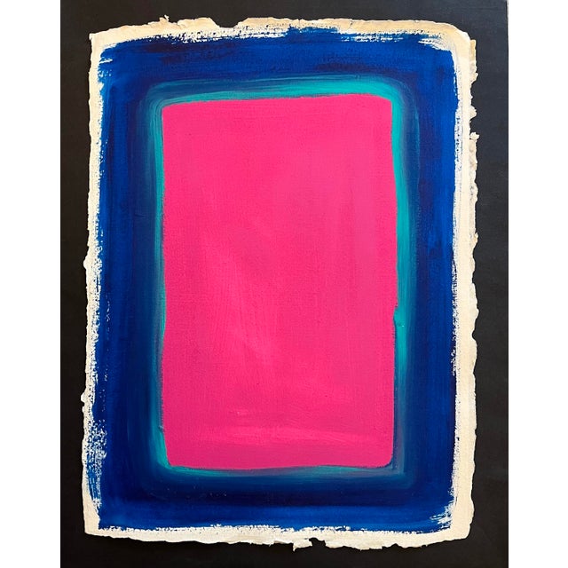 Oil painting on deckle edge cotton rag artist paper of a large rose color field surrounded by an aqua green border...