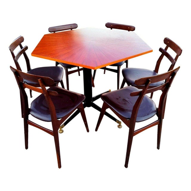 A splendid original 1960s set comprising a hexagonal rosewood table, designed by Ignazio Gardella for Azucena, and six...