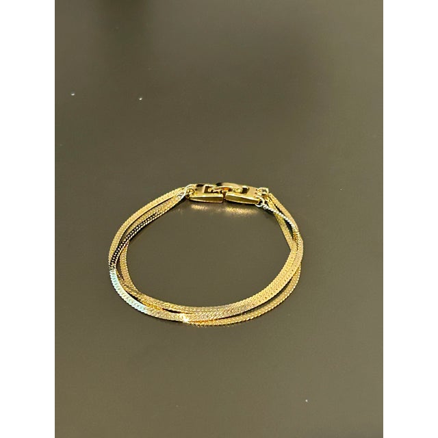 Vintage Monet Gold-Tone Multi-Strand Flat Weave Chain Bracelet – Iconic 1970s/1980s Statement Jewelry Add a touch of...