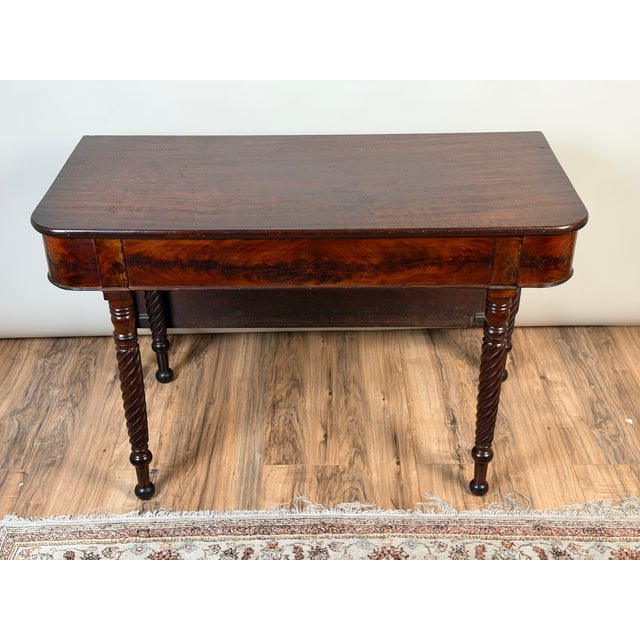 This handsome American Classical mahogany table, dating to approximately 1830–1845, combines the restrained proportions of...
