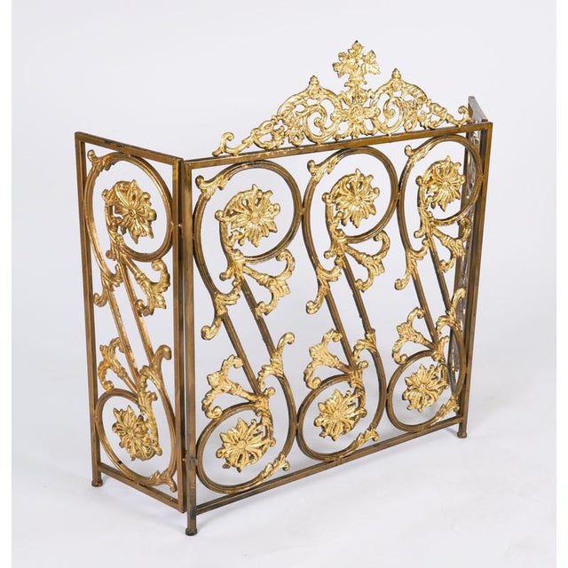 This is a superb and very decorative French Louis XIV revival gilded brass fire-screen, circa 1880 in date. The adjustable...
