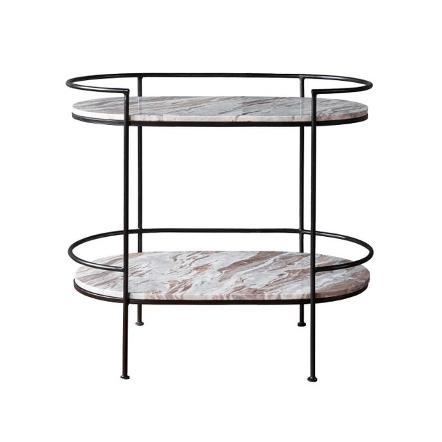 New Item, The oval-shaped Lenox Bar Table features two tiers of marble shelves supported by a black iron frame. Each tier...