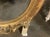 This product is a rare and elegant 19th century French ornately carved giltwood oval mirror. The intricate detailing and...