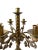 The antique bronze candelabra you're describing likely features an elegant and ornate design, characterized by its semi-...
