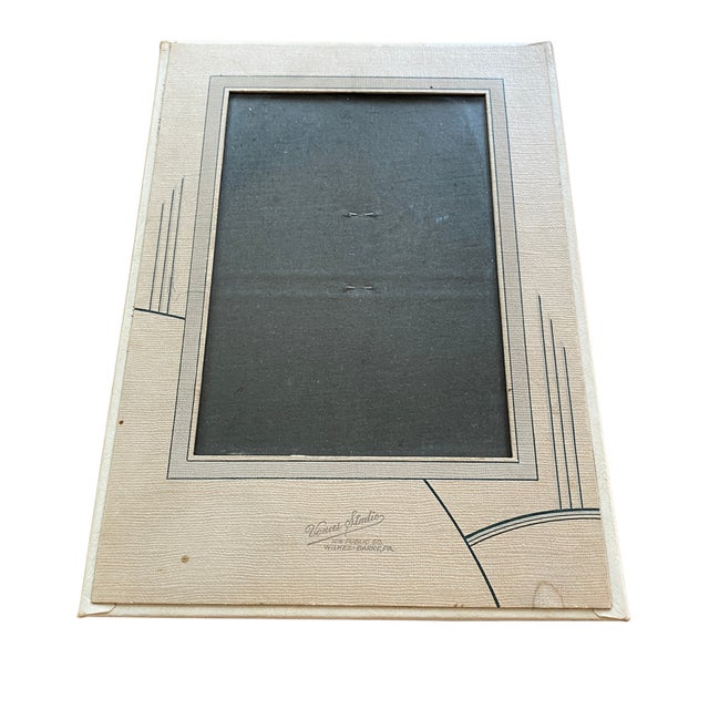This vintage Venus Studio picture frame features a textured ivory leatherette finish with elegant Art Deco-inspired...