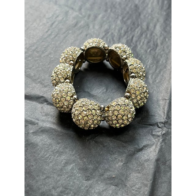 Art Deco Revival stretch bracelet featuring silver-tone pave rhinestone beads on an elastic band. The uniform 12mm...